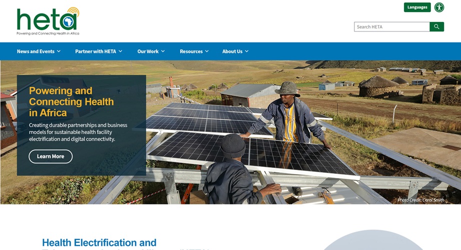 HETA website homepage — Powering and Connecting Health in Africa, with solar panel installation hero image